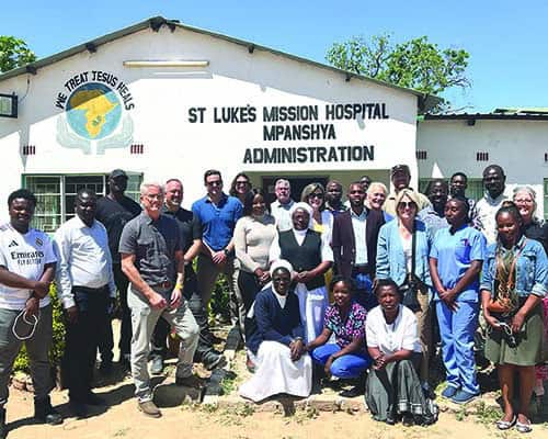 Lisa Hohman and other volunteers in Zambia where they worked with healthcare leaders and highlighted the universal need for improved systems